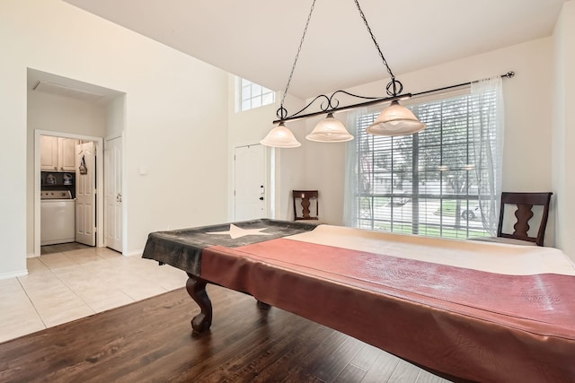 8633 Shadow Trace Dr, Fort Worth, TX 76244 - recreation room with washer / clothes dryer, light wood-style floors, and baseboards