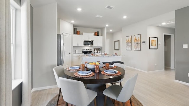 857 Cedarbrook, Fort Worth, TX 76131 - dining area featuring light wood-style flooring, recessed lighting, and baseboards