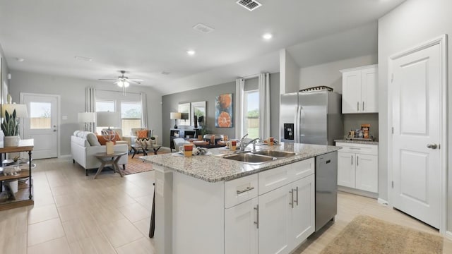 857 Cedarbrook, Fort Worth, TX 76131 - kitchen with a sink, stainless steel appliances, white cabinetry, recessed lighting, and a center island with sink