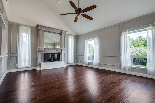 4113 Southwood E, Colleyville, TX 76034 - unfurnished living room with a decorative wall, ceiling fan, high vaulted ceiling, a fireplace, and dark wood-style flooring