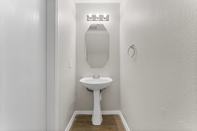 1817 Cedarbriar Dr, Mesquite, TX 75181 - bathroom featuring wood finished floors and baseboards
