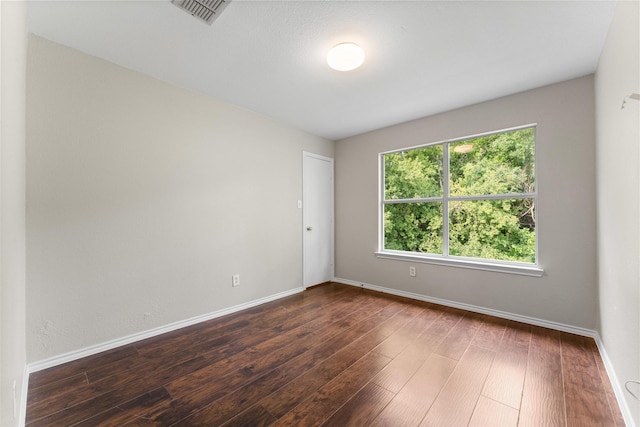 1817 Cedarbriar Dr, Mesquite, TX 75181 - unfurnished room featuring dark wood-type flooring and baseboards