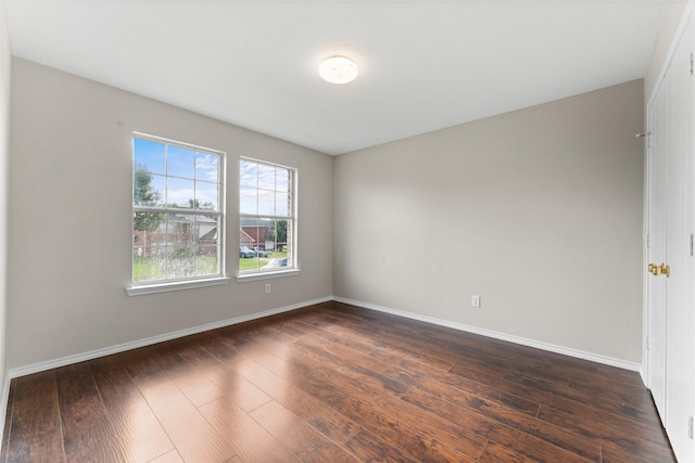1817 Cedarbriar Dr, Mesquite, TX 75181 - spare room with dark wood-style flooring and baseboards