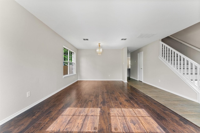 1817 Cedarbriar Dr, Mesquite, TX 75181 - empty room featuring wood-type flooring, stairway, and baseboards