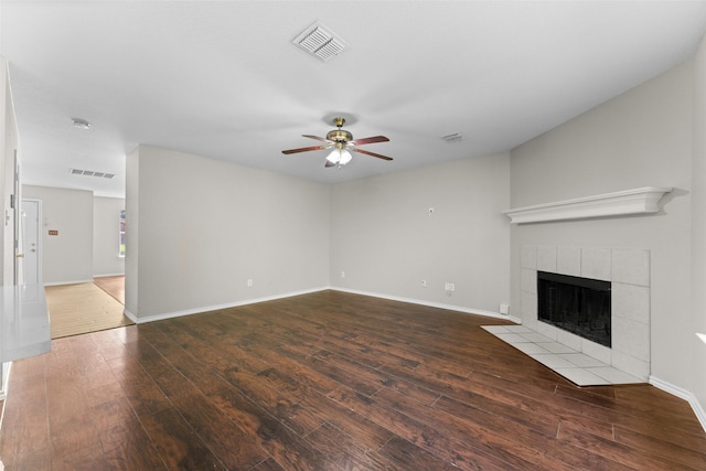 1817 Cedarbriar Dr, Mesquite, TX 75181 - unfurnished living room with a fireplace, hardwood / wood-style floors, a ceiling fan, and baseboards