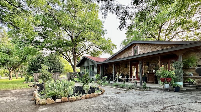 4000 Pecan Ln, Benbrook, TX 76116 - view of side of home with covered porch and stone siding