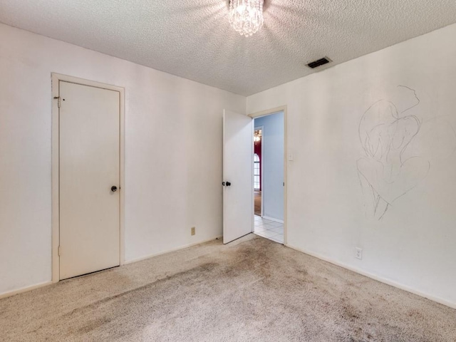 809 S Ridgeway Dr, Cleburne, TX 76033 - carpeted empty room featuring a textured ceiling