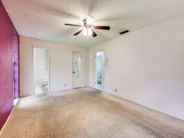 809 S Ridgeway Dr, Cleburne, TX 76033 - empty room featuring a ceiling fan, light colored carpet, and a textured ceiling