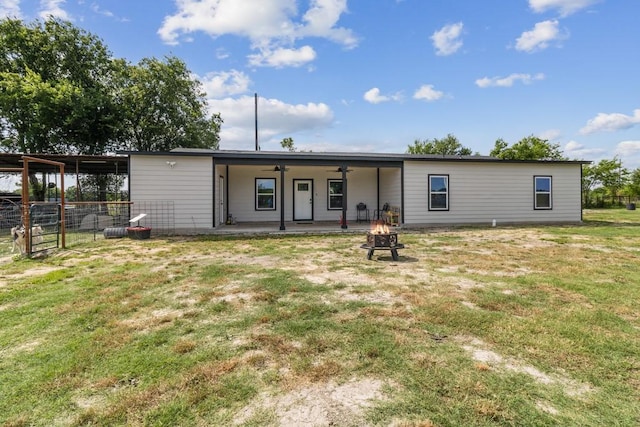 9759 Fm 638, Dawson, TX 76639 - back of property featuring a fire pit, ceiling fan, and a carport