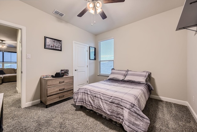 14613 Bootes Dr, Haslet, TX 76052 - carpeted bedroom with multiple windows, baseboards, and a ceiling fan