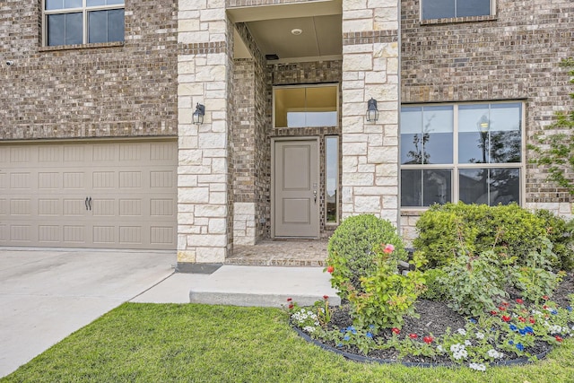14613 Bootes Dr, Haslet, TX 76052 - property entrance with a garage, brick siding, and stone siding