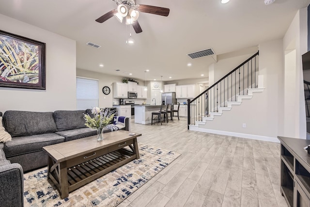 14613 Bootes Dr, Haslet, TX 76052 - living area with a ceiling fan, light wood-style flooring, stairs, baseboards, and recessed lighting