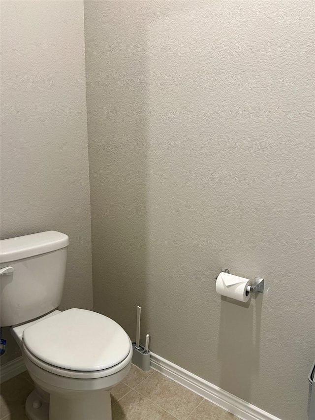 6413 Tudor Pl, Celina, TX 76227 - bathroom featuring toilet, baseboards, and tile patterned flooring
