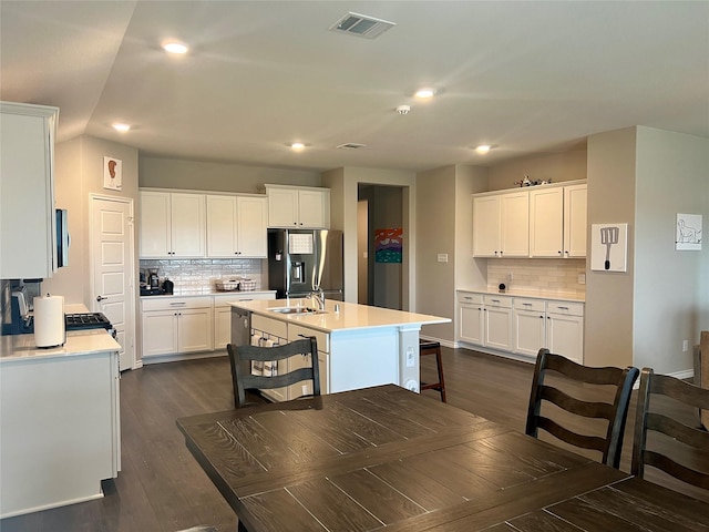 6413 Tudor Pl, Celina, TX 76227 - kitchen featuring appliances with stainless steel finishes, a sink, backsplash, recessed lighting, and light countertops