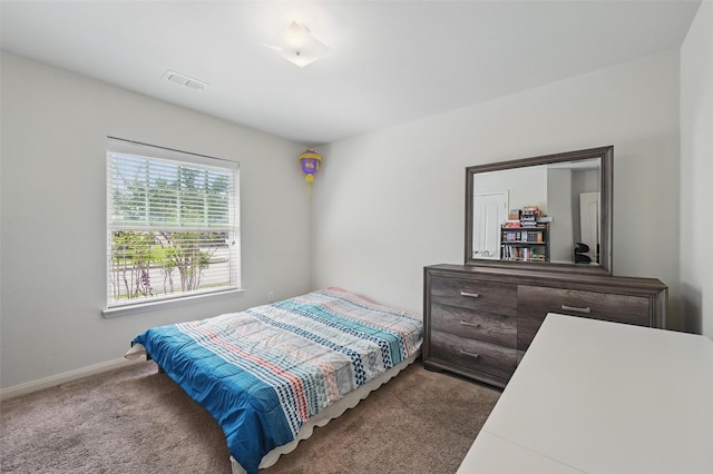 1445 Macy Ln, Dallas, TX 75253 - carpeted bedroom featuring baseboards