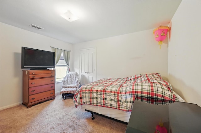 1445 Macy Ln, Dallas, TX 75253 - carpeted bedroom with baseboards and a closet