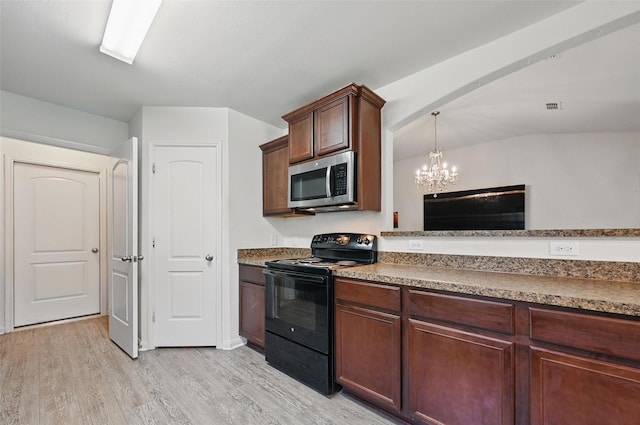1445 Macy Ln, Dallas, TX 75253 - kitchen with stainless steel microwave, black / electric stove, a chandelier, light wood finished floors, and vaulted ceiling