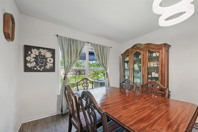 1445 Macy Ln, Dallas, TX 75253 - dining room featuring a chandelier, wood finished floors, and baseboards
