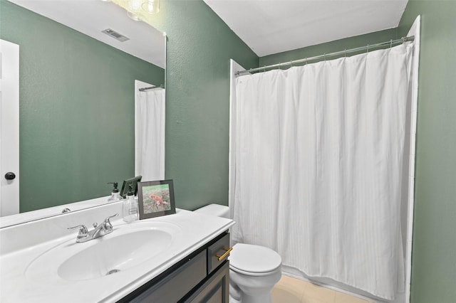 4100 Creekhollow Dr, Carrollton, TX 75010 - full bathroom with toilet, vanity, tile patterned floors, a textured wall, and a shower with shower curtain