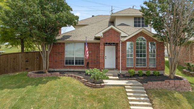 4100 Creekhollow Dr, Carrollton, TX 75010 - traditional home with roof with shingles, brick siding, and a gate