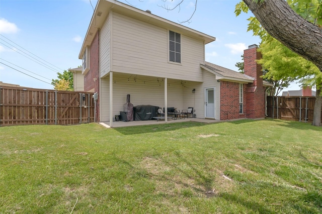 4100 Creekhollow Dr, Carrollton, TX 75010 - rear view of property with a patio, a chimney, and brick siding