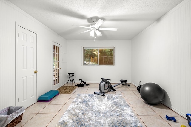 3905 Shady Creek Dr, Euless, TX 76040 - workout area featuring tile patterned floors, crown molding, ceiling fan, and a textured ceiling
