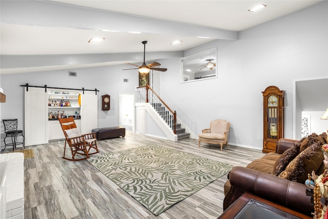 3905 Shady Creek Dr, Euless, TX 76040 - living area featuring ceiling fan, a barn door, light wood-style floors, stairs, and recessed lighting