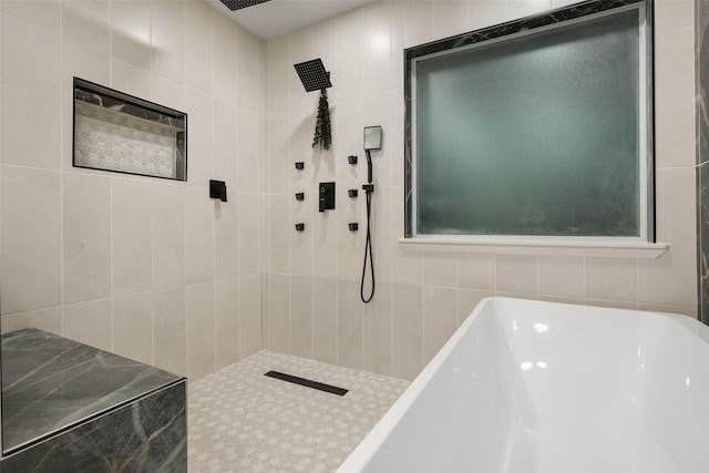1711 Sage Dr, Midlothian, TX 76065 - full bathroom with tile walls, a freestanding bath, and a tile shower