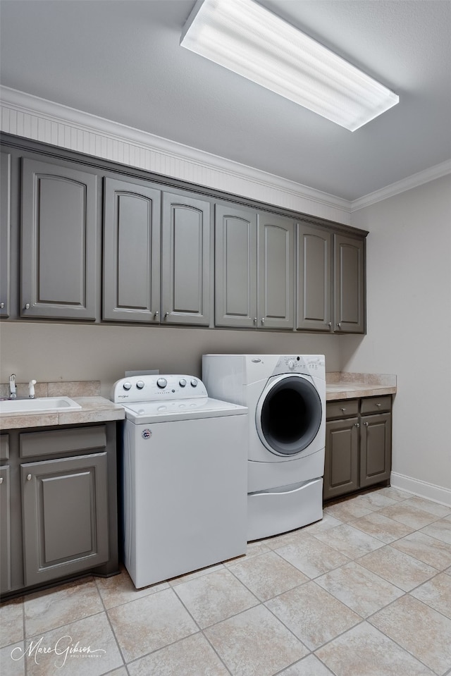 145 Carondelet Ct, Bossier City, LA 71111 - laundry area featuring cabinet space, independent washer and dryer, crown molding, baseboards, and light tile patterned flooring