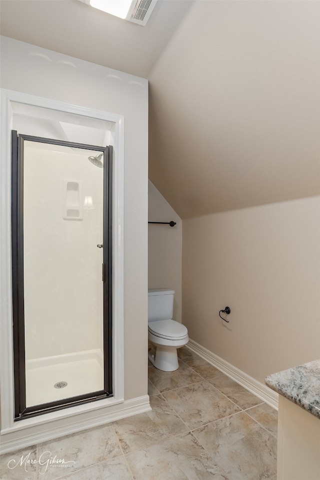 145 Carondelet Ct, Bossier City, LA 71111 - bathroom with lofted ceiling, a stall shower, toilet, vanity, and baseboards