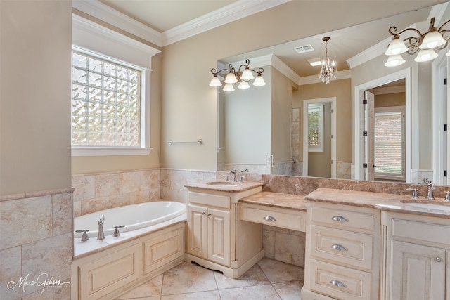 145 Carondelet Ct, Bossier City, LA 71111 - full bathroom with a garden tub, ornamental molding, two vanities, wainscoting, and tile walls