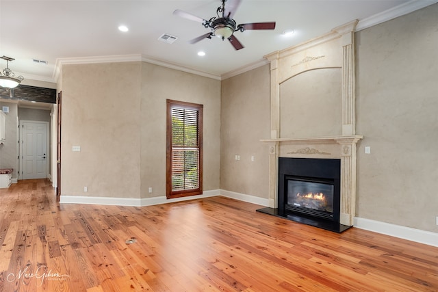 145 Carondelet Ct, Bossier City, LA 71111 - unfurnished living room featuring light wood-style flooring, a ceiling fan, a large fireplace, crown molding, and recessed lighting