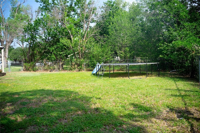 2204 13th St, Brownwood, TX 76801 - view of yard featuring a trampoline