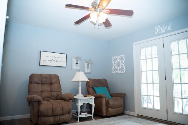2204 13th St, Brownwood, TX 76801 - living area with wood finished floors, baseboards, and ceiling fan