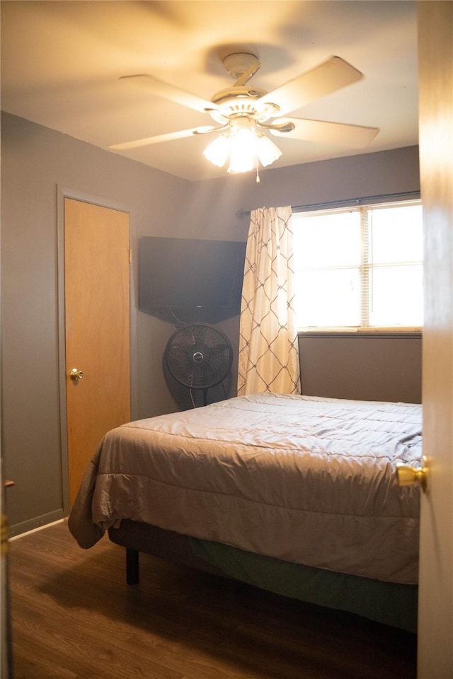 2204 13th St, Brownwood, TX 76801 - bedroom featuring wood finished floors and a ceiling fan