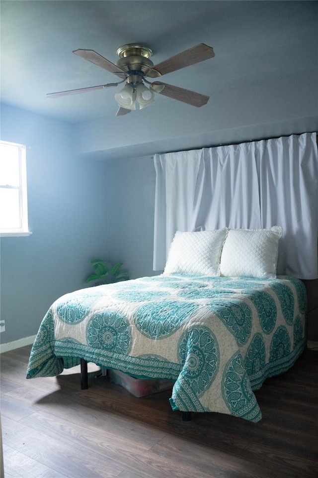 2204 13th St, Brownwood, TX 76801 - bedroom featuring wood finished floors, a ceiling fan, and baseboards