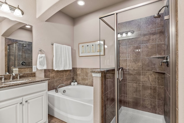 544 S Greenville Ave, Richardson, TX 75081 - full bathroom with a bath, a shower stall, and vanity