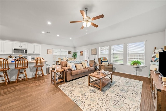 609 Autumn Ave, Justin, TX 76247 - living room featuring a ceiling fan, light wood-style floors, recessed lighting, vaulted ceiling, and baseboards