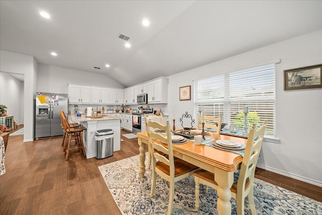 609 Autumn Ave, Justin, TX 76247 - dining room featuring vaulted ceiling, wood finished floors, and recessed lighting
