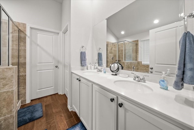609 Autumn Ave, Justin, TX 76247 - bathroom with a stall shower, double vanity, wood finished floors, and recessed lighting