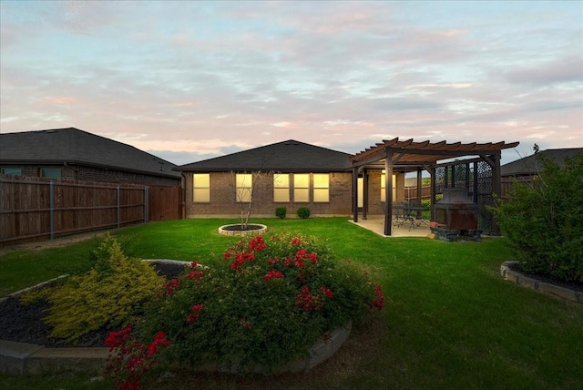 609 Autumn Ave, Justin, TX 76247 - rear view of house with a pergola, a patio, and brick siding