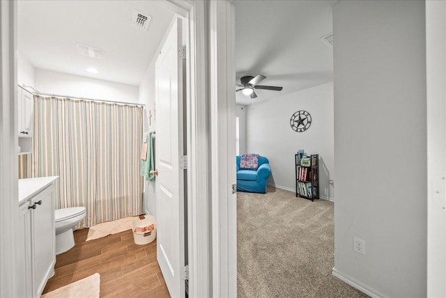 609 Autumn Ave, Justin, TX 76247 - full bathroom with toilet, ceiling fan, a shower with curtain, vanity, and baseboards