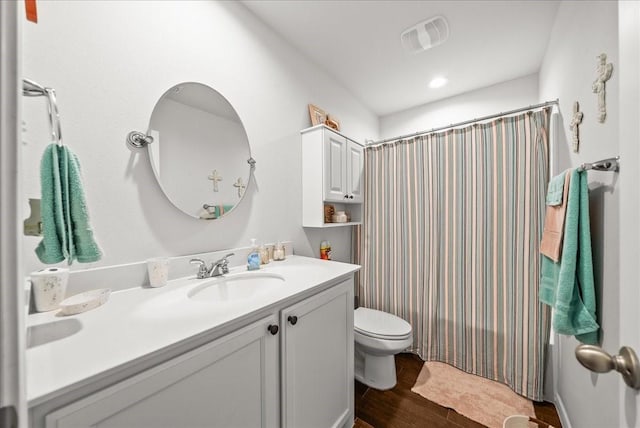609 Autumn Ave, Justin, TX 76247 - bathroom with toilet, vanity, wood finished floors, and a shower with curtain