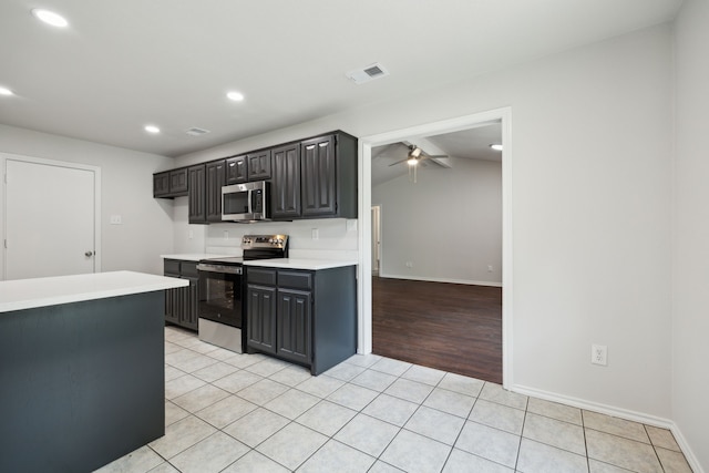 315 Oakwood Cir, Shady Shores, TX 76208 - kitchen featuring stainless steel appliances, light countertops, a ceiling fan, recessed lighting, and light tile patterned flooring