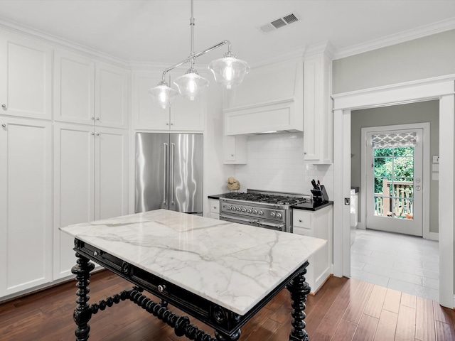 411 Jordan Farm Cir, Rockwall, TX 75087 - kitchen featuring high end appliances, white cabinets, dark wood-style floors, and crown molding