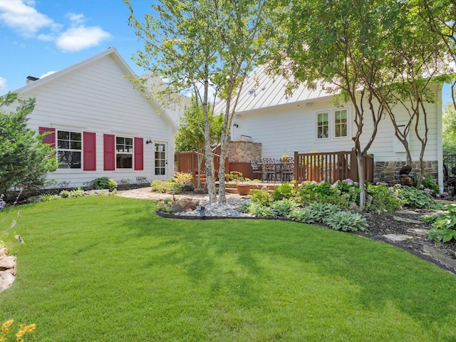 411 Jordan Farm Cir, Rockwall, TX 75087 - back of house with a lawn, stone siding, and a deck