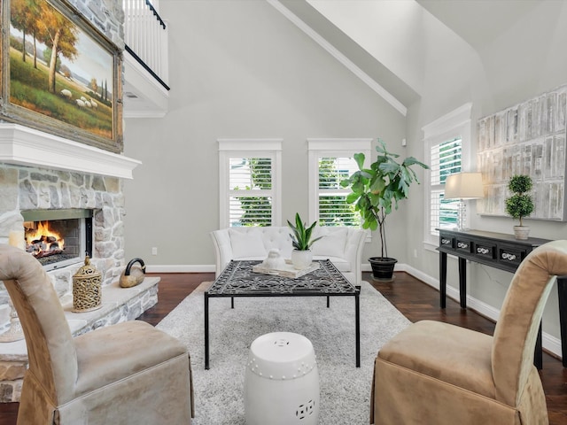 411 Jordan Farm Cir, Rockwall, TX 75087 - living area featuring high vaulted ceiling, plenty of natural light, wood finished floors, a fireplace, and baseboards