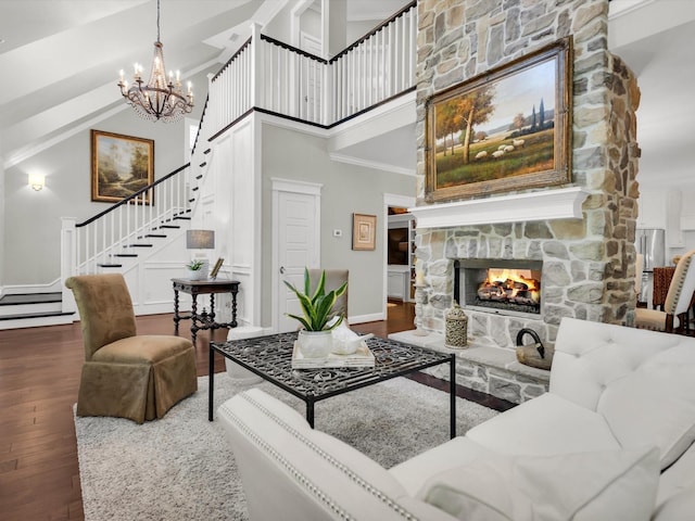 411 Jordan Farm Cir, Rockwall, TX 75087 - living area with stairway, wood finished floors, a high ceiling, a chandelier, and a fireplace