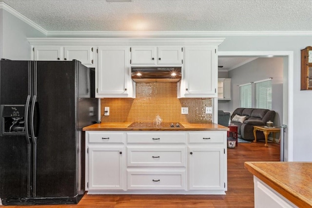 108 Neely Rd, Hewitt, TX 76643 - kitchen with black appliances, under cabinet range hood, light wood finished floors, white cabinetry, and ornamental molding