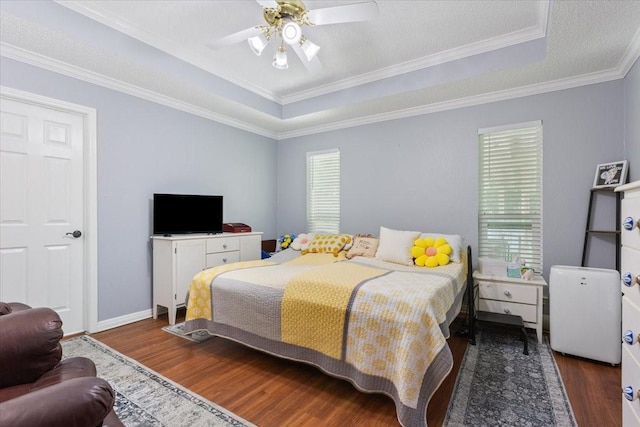 108 Neely Rd, Hewitt, TX 76643 - bedroom featuring wood finished floors, a raised ceiling, crown molding, ceiling fan, and baseboards